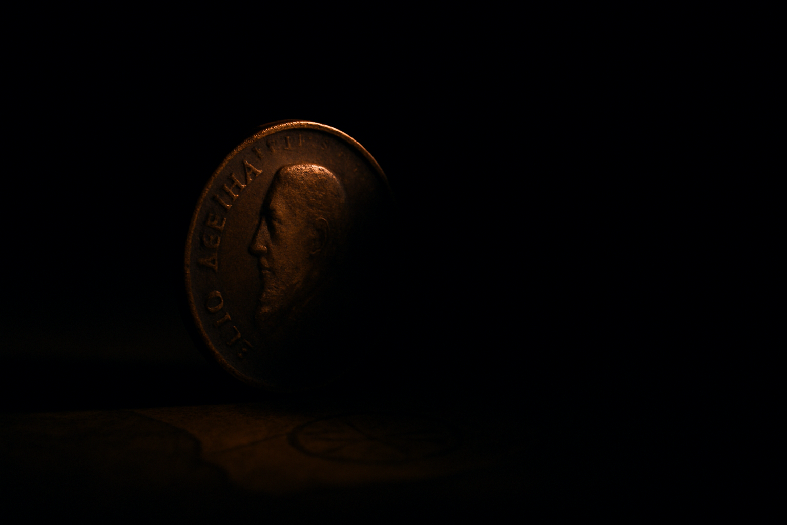 Single coin emerging from shadow symbolizing hidden meaning