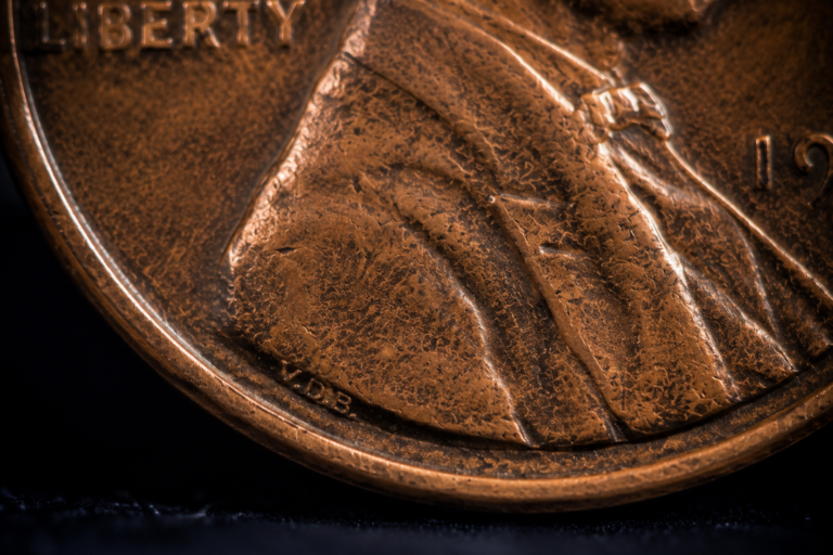 Close-up showing the tiny VDB initials on a Lincoln Wheat Penny.